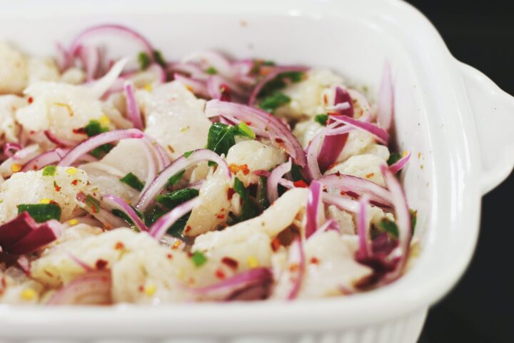 sliced vegetables in white ceramic bowl