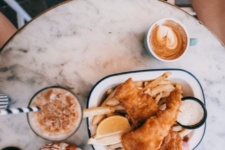 fried food with two cup of drinks on table